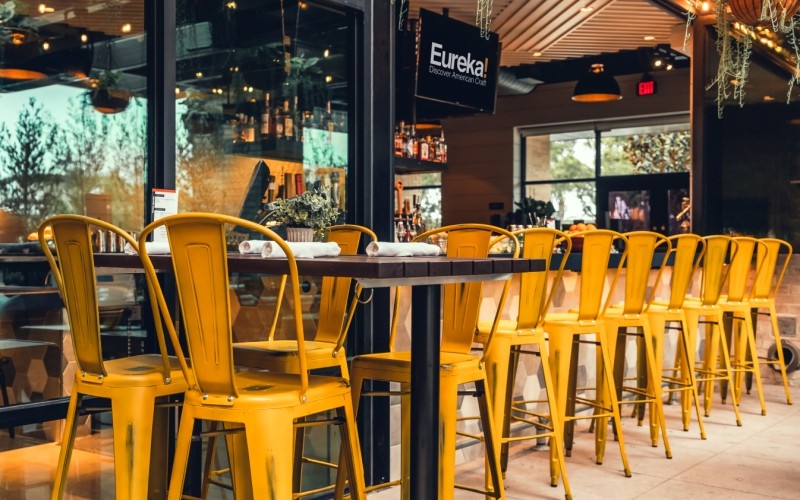 Our Westinghouse Distressed bar stools in yellow create a nice pop of color